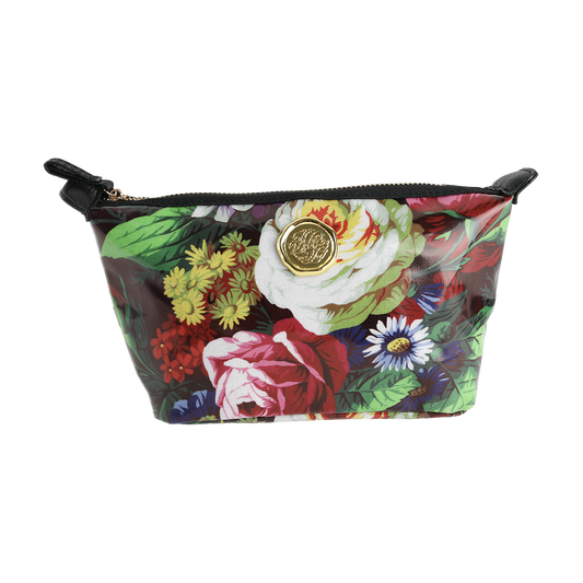 The Astrid Small Cosmetic Bag features a zippered closure, a vibrant botanical floral print, and a gold medallion accent on the front, shown against a white background.