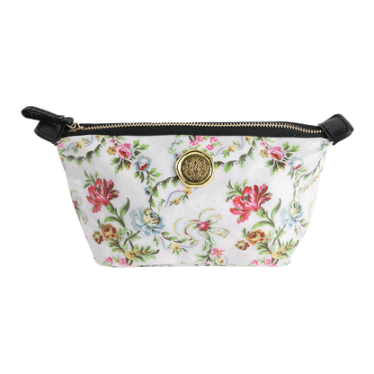 Phoebe Small Cosmetic Bag: This floral-patterned zippered pouch from the Phoebe florals collection features black accents and a gold circular medallion on the front. Crafted from laminated cotton, it offers durability and easy cleaning.