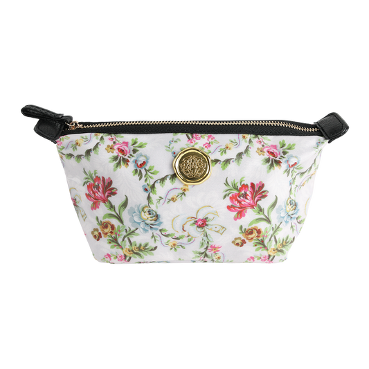 Phoebe Small Cosmetic Bag: This floral-patterned zippered pouch from the Phoebe florals collection features black accents and a gold circular medallion on the front. Crafted from laminated cotton, it offers durability and easy cleaning.