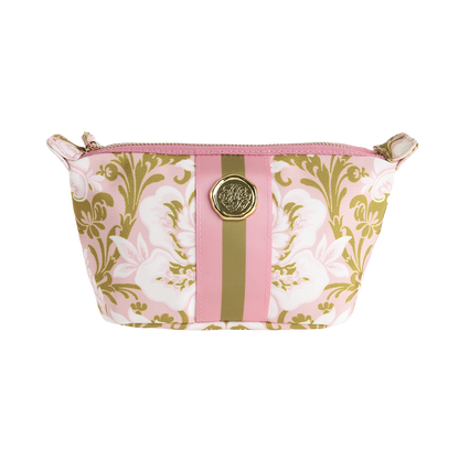 The Pink Damask Small Cosmetic Bag features a zippered closure, a pink and gold floral pattern with central pink and gold stripes, and a round gold emblem on the front. This stylish makeup bag is perfect for keeping your everyday essentials organized.