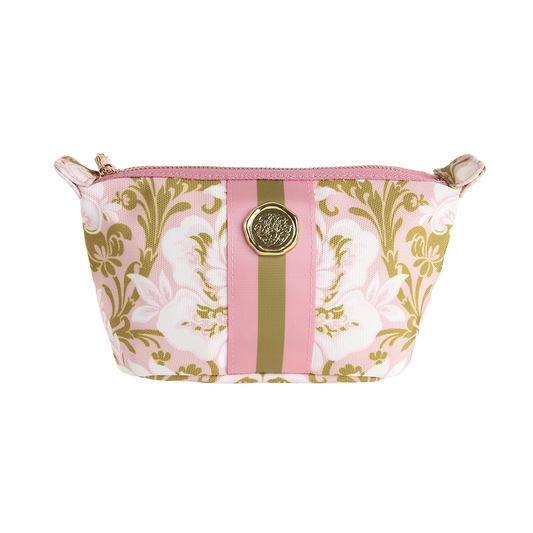 The Pink Damask Small Cosmetic Bag features a zippered closure, a pink and gold floral pattern with central pink and gold stripes, and a round gold emblem on the front. This stylish makeup bag is perfect for keeping your everyday essentials organized.