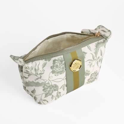 The Green Climbing Rose Small Cosmetic Bag is a zippered fabric makeup bag featuring a green floral pattern, gold button, and olive stripe, shown open and empty against a white background.