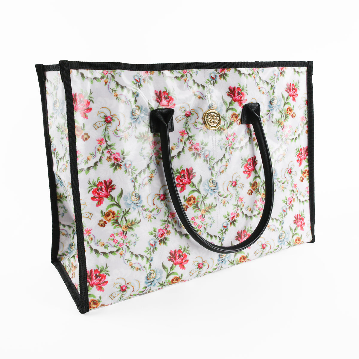 Introducing the Phoebe Tote Bag—a spacious rectangular tote featuring black handles and trim, with a white background beautifully decorated in a lively red, pink, and green floral pattern. As an ideal large tote bag for women seeking both style and practicality, it’s perfect for everyday use as a chic shoulder bag.