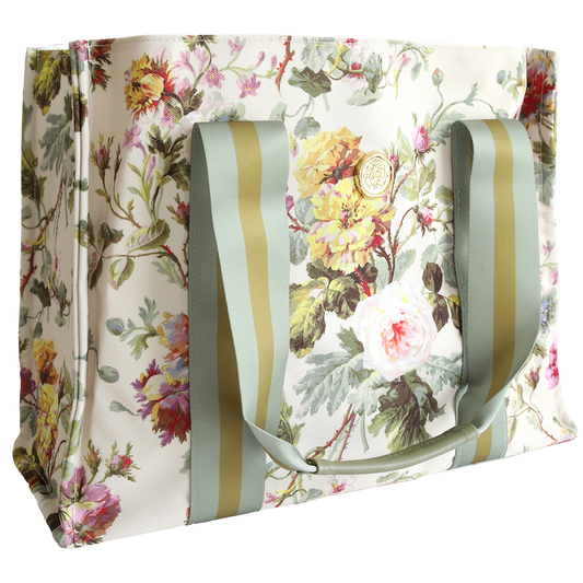 The Francesca Tote Bag is a rectangular, all-purpose cotton tote with a floral print, large green-striped handles, and a cream background for stylish durability.