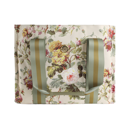 Introducing the Francesca Tote Bag: a spacious canvas tote featuring green striped handles and a beautiful floral print of roses and leaves on a light background—ideal as a floral market bag and a thoughtful gift for women.