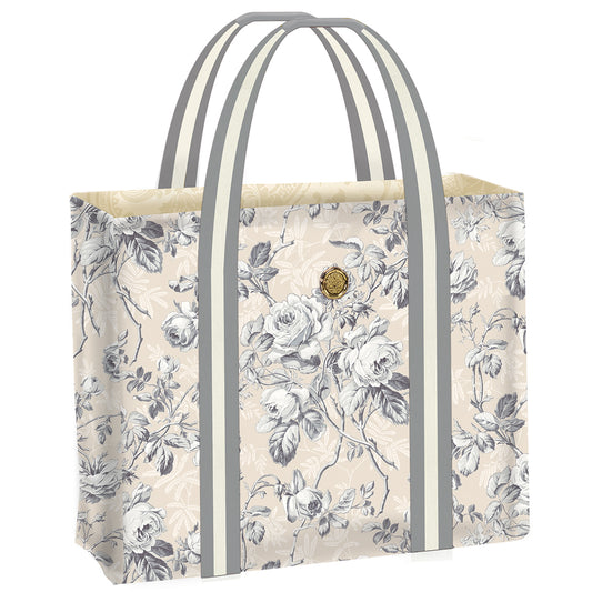 The Faded Rose Tote Bag features a beige background adorned with a gray floral pattern and is equipped with two gray handles.