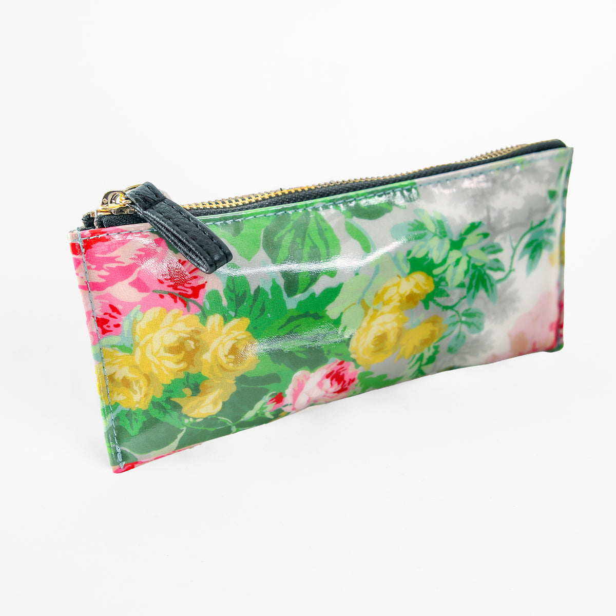 The Virginia Pencil Case is a rectangular zipper pouch adorned with a vibrant floral pattern featuring yellow, green, pink, and red flowers on a crisp white background. Accented with a dark green zipper pull, this charming accessory makes an ideal, stylish pencil bag for women who appreciate bold and colorful designs.