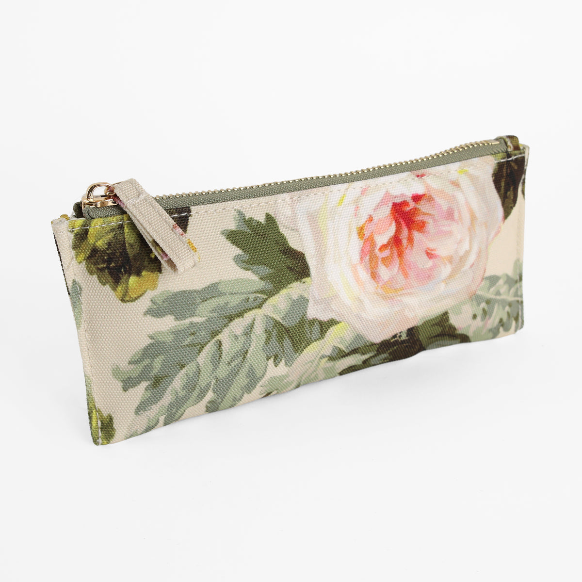 The Francesca Pencil Case is a rectangular zippered pouch featuring a charming botanical print with a large pink and white flower and green leaves on a beige background—perfect for organizing your essentials.