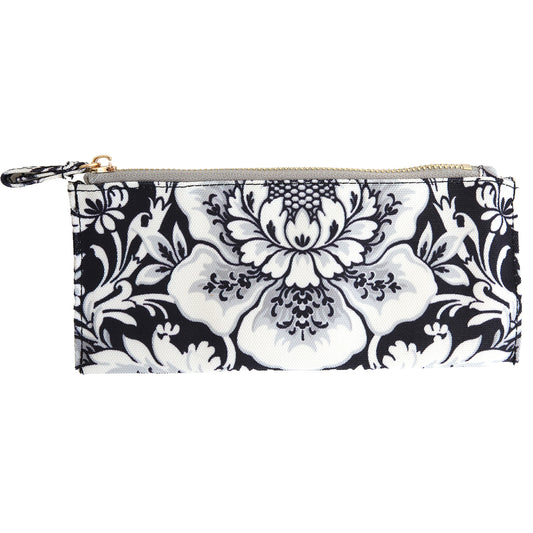 The Damask Noire Pencil Case is a rectangular cotton case with a black and white floral pattern, zippered closure, and a small wrist strap on the left side.
