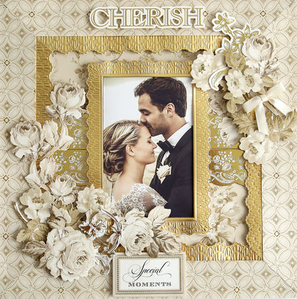 A framed photograph of a bride and groom on their wedding day is surrounded by intricate floral decorations featuring diecut titles with the words "Cherish" and "Special Moments" prominently displayed, accompanied by Faded Rose Papers and Embellishments.