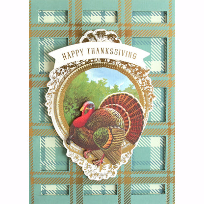 An Anna Griffin Fall Plaid Cardstock with a turkey on a plaid background made of cardstock.