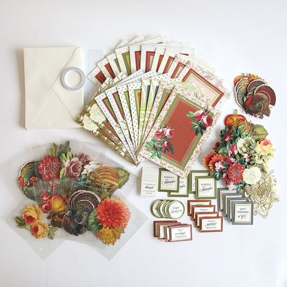 The "Folded Fall Card Making Kit" features beautiful cards, various envelopes, decorative papers, floral stickers, and embellishments arranged neatly on a white surface. Perfect for 3D card making kit projects or adding a surprise inside special notes.