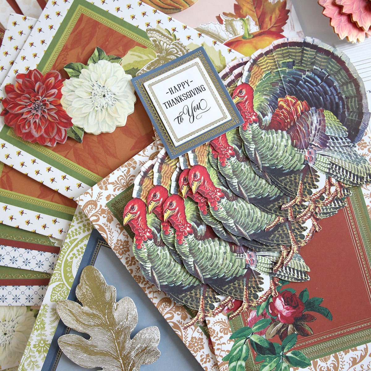 Introducing the Folded Fall Card Making Kit, a delightful collection of beautifully designed Thanksgiving greeting cards adorned with charming turkey and floral motifs. One standout card prominently features the warm message "Happy Thanksgiving to You." Additionally, some cards include a special surprise hidden inside, adding an extra element of joy.