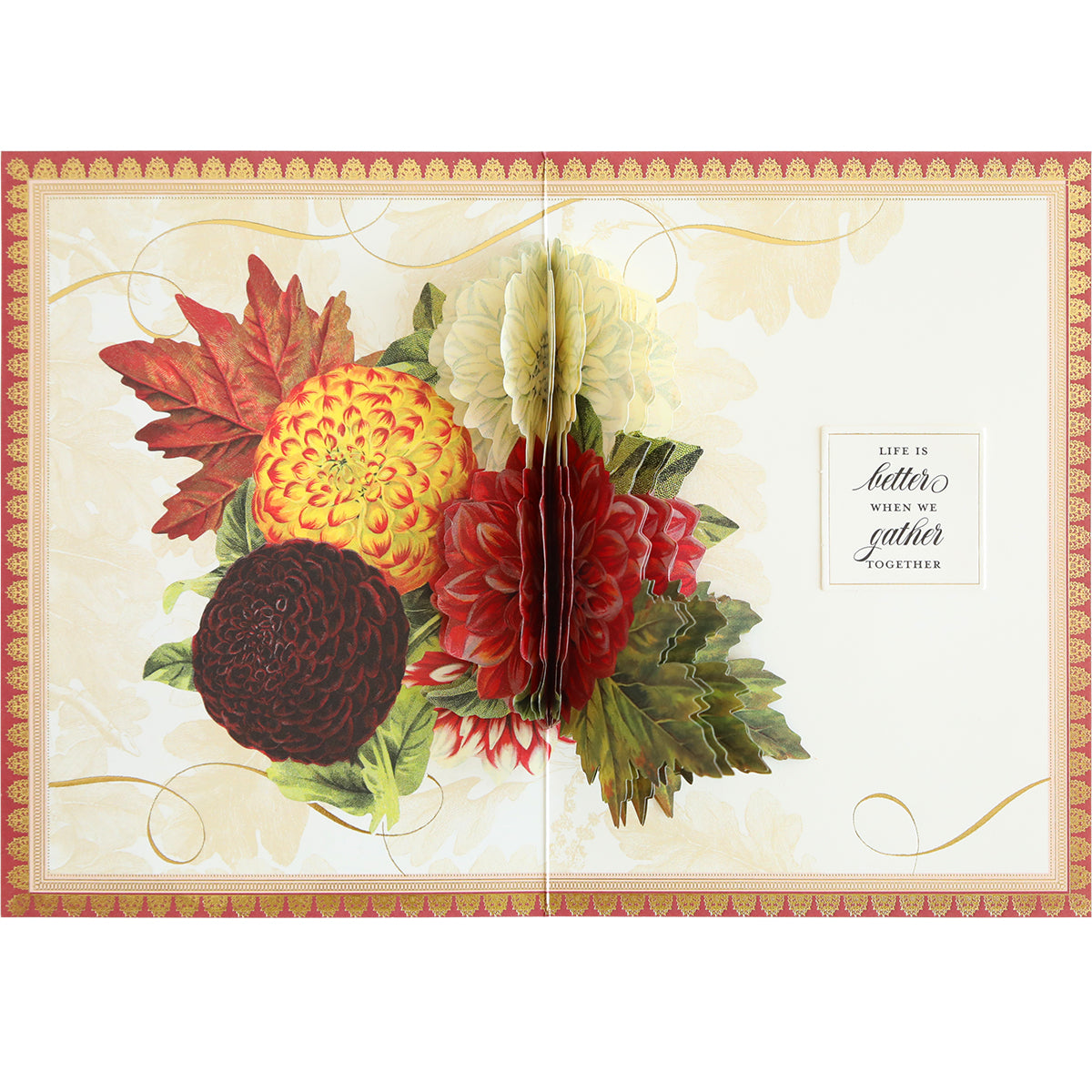 Introducing the Folded Fall Card Making Kit: This kit allows you to create a pop-up card adorned with a bouquet of vibrant flowers and includes a heartfelt message stating, "Life is better when we gather together." The card boasts ornate borders, a white and gold patterned background, and reveals a delightful surprise inside.