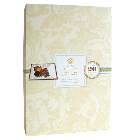 Front cover of a Folded Fall Card Making Kit featuring an intricate, beige floral design and a small image of flowers. The text highlights that the kit creates 20 unique, stunning cards with a surprise element inside for added delight.