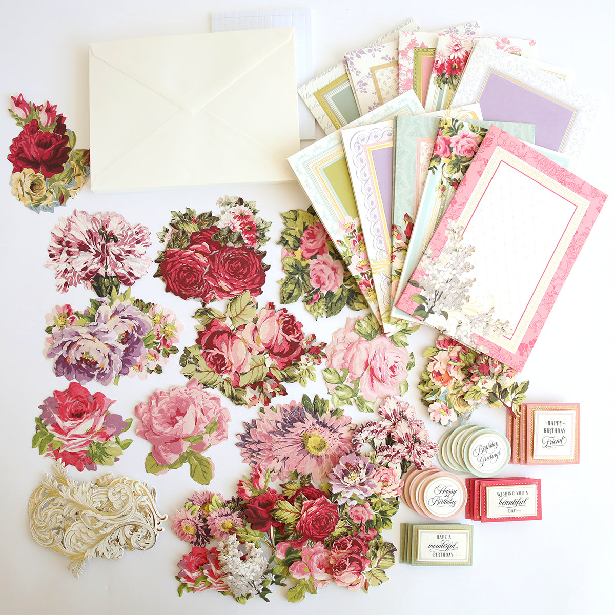 Folded Flower Birthday Card Kit, envelopes, and embellishments spread out on a white surface.
