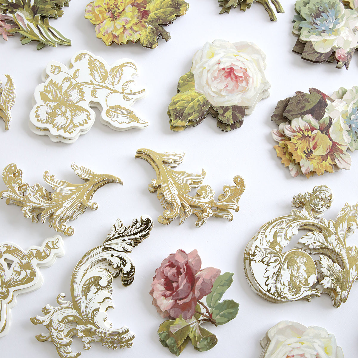 Francesca Embellishments, featuring gold ornate designs and dimensional floral stickers, are arranged on a white background.