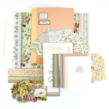 Assorted decorative papers, patterned cards, and cardstock from the Ultimate Francesca Papercrafting Collection with Rub Ons are arranged in a flat lay alongside scrapbook supplies and floral rub on transfers—perfect for crafting or scrapbooking.