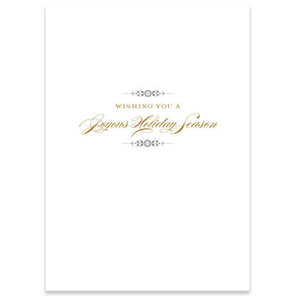 The White Poinsettia Card Box 10ct includes handmade holiday cards with a white background, featuring elegant text that reads "Wishing You a Joyous Holiday Season" in gold and black script. Each card is adorned with simple decorative flourishes and finished with a sophisticated foil touch.