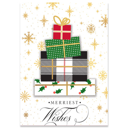 A charming scene featuring a stack of five wrapped gifts with various patterns is displayed against a white background adorned with gold snowflakes and stars. The text "Merriest Wishes" graces the bottom, evoking the charm of handmade holiday cards—perfect for sharing Christmas joy. This delightful design is part of the "Plaid Gift Tree Card Box 10 ct.