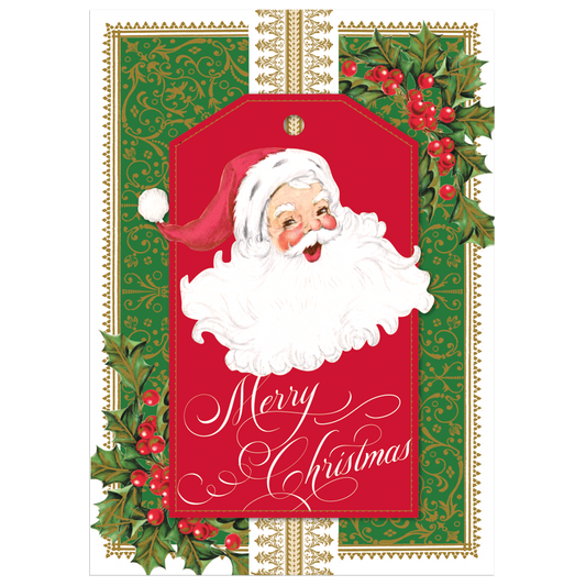 The Merry Santa Boxed Card 10 count set features Christmas cards with a cheerful Santa Claus on a red tag, adorned with the text "Merry Christmas" in an elegant script. The green background with gold detailing and holly decorations makes these cards an exquisite addition to any handmade holiday card collection.