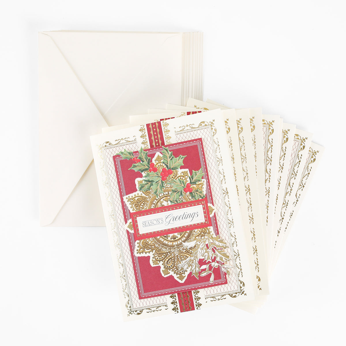 A box of 10 Gilded Filigree holiday cards featuring elegant red and gold designs with “Season’s Greetings” text, paired with matching cream envelopes and displayed on a white surface.