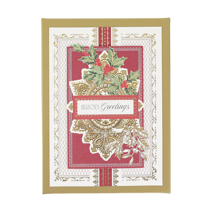 The Gilded Filigree Boxed Cards 10 ct features a festive design with holly leaves and red berries, accented with elegant gold detailing reminiscent of classic gilded holiday cards, and showcases the text “Season’s Greetings” on a bold red and white background.