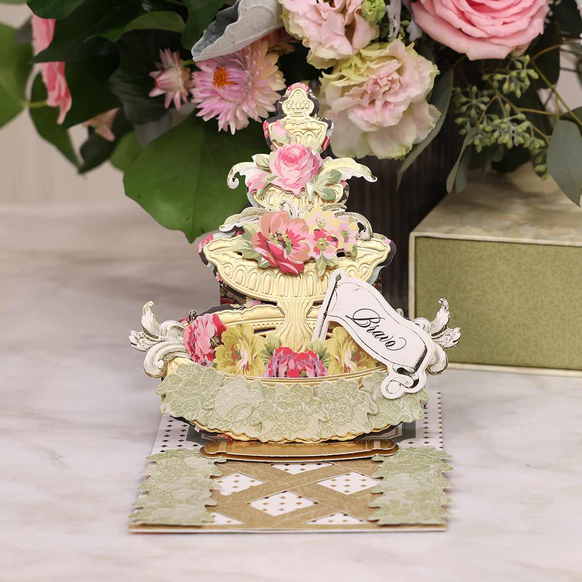 A beautiful Garden Fountain Finishing School Class card adorned with delicate flowers, made by Anna Griffin.