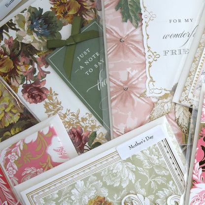 The Handmade Card Assortment features a close-up view of unique greeting cards, including dimensional and handmade designs for Mother’s Day and friends.