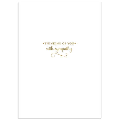 The Amelie Condolences Card features "Thinking of You with Sympathy" elegantly embossed in gold foil on a pristine white background, and includes a printed lined envelope.