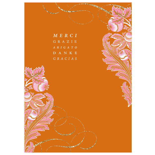 The Damask Thank You Card features floral patterns in white and pink on an orange background, with "Merci," "Grazie," "Arigato," "Danke," and "Gracias" in crisp white text, and includes a lined envelope for elegance.