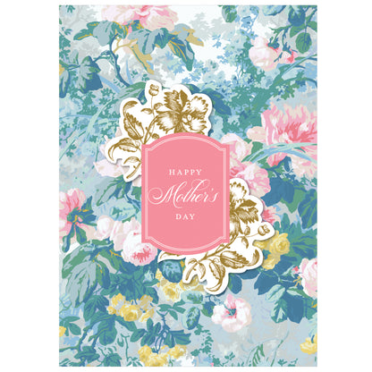 The Virginia Floral Happy Mother's Day Card features a floral background with decorative accents around a pink label reading "Happy Mother's Day" in white script, paired with a printed lined envelope for added elegance.