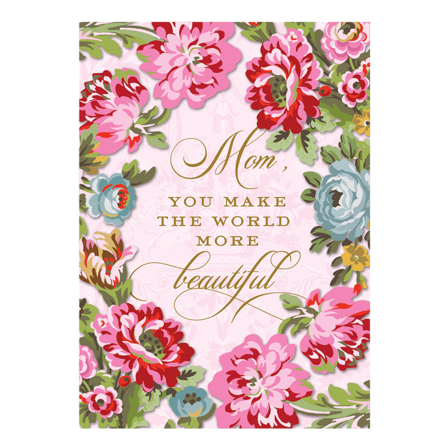 The Floral Wreath Mom Card features pink, red, and blue flowers with gold foil text saying, "Mom, you make the world more beautiful." It includes a printed lined envelope and measures 5" x 7".