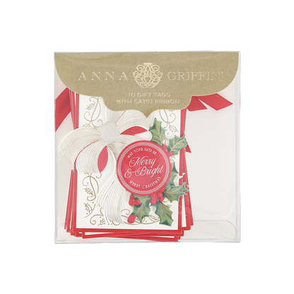 A package of Heirloom Holly Tag 10 ct by Anna Griffin includes 10 Christmas gift tags with satin ribbon, featuring a festive holly design, a white bow, and “Merry & Bright” text.