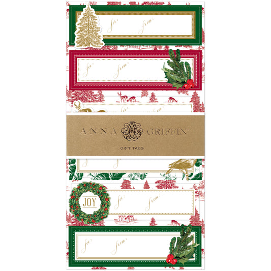The Christmas Toile 3D Labels 24ct features rectangular holiday gift tags with festive designs, gold foil accents, and "To/From" labels—perfect for gifting—packaged with a brown Anna Griffin band.