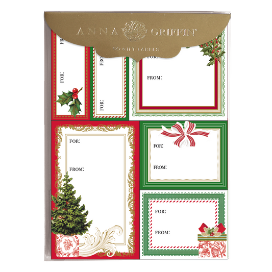 The Christmas Wishes Label Sheet 60 ct features an array of assorted holiday gift labels adorned with festive borders including holly, a Christmas tree, and ornaments. Each label includes "For" and "From" fields for personalization.