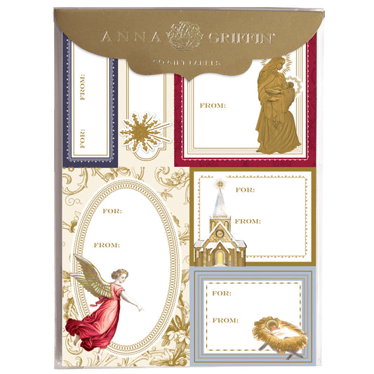 The Religious Label 72ct features decorative gift tag stickers with vintage Christmas designs like angels, a church, and a nativity scene, plus gold foil accents. Each label includes "For:" and "From:" fields for personalizing your gifts.