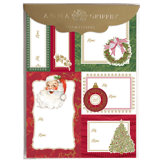 A 72-count pack of Jolly Santa Labels featuring festive Christmas designs—Santa, wreath, ornament, holly, and decorated tree—on red, green, and white with elegant gold foil accents.