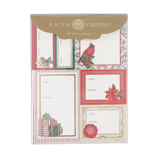 A package of Classic Yuletide Labels contains 72 Christmas gift tags featuring six festive designs with holiday motifs such as poinsettias, a cardinal, wrapped gifts, and holly berries.
