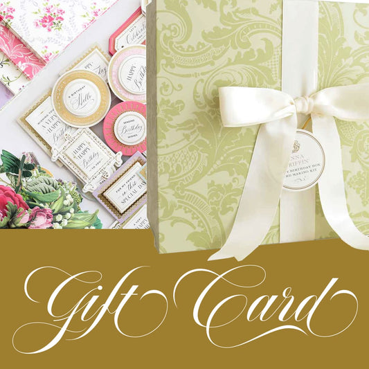 An Anna Griffin gift card valid for 1 year, redeemable for annagriffin.com purchases, adorned with flowers and ribbon.