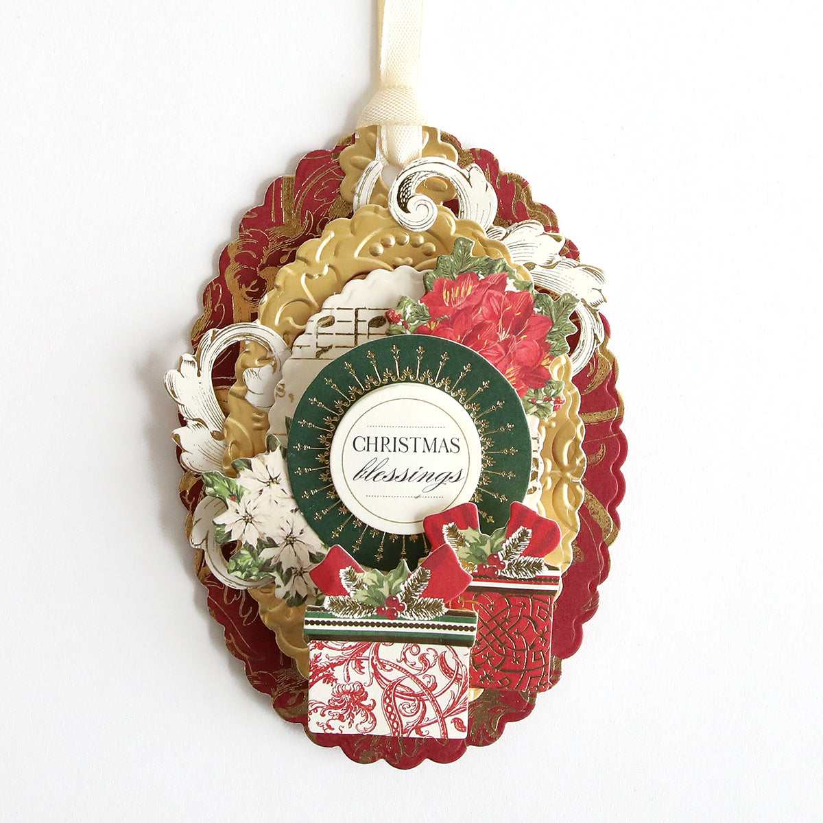 A personalized Christmas ornament hanging on a chain with a Gift Tag Compendium Dies.