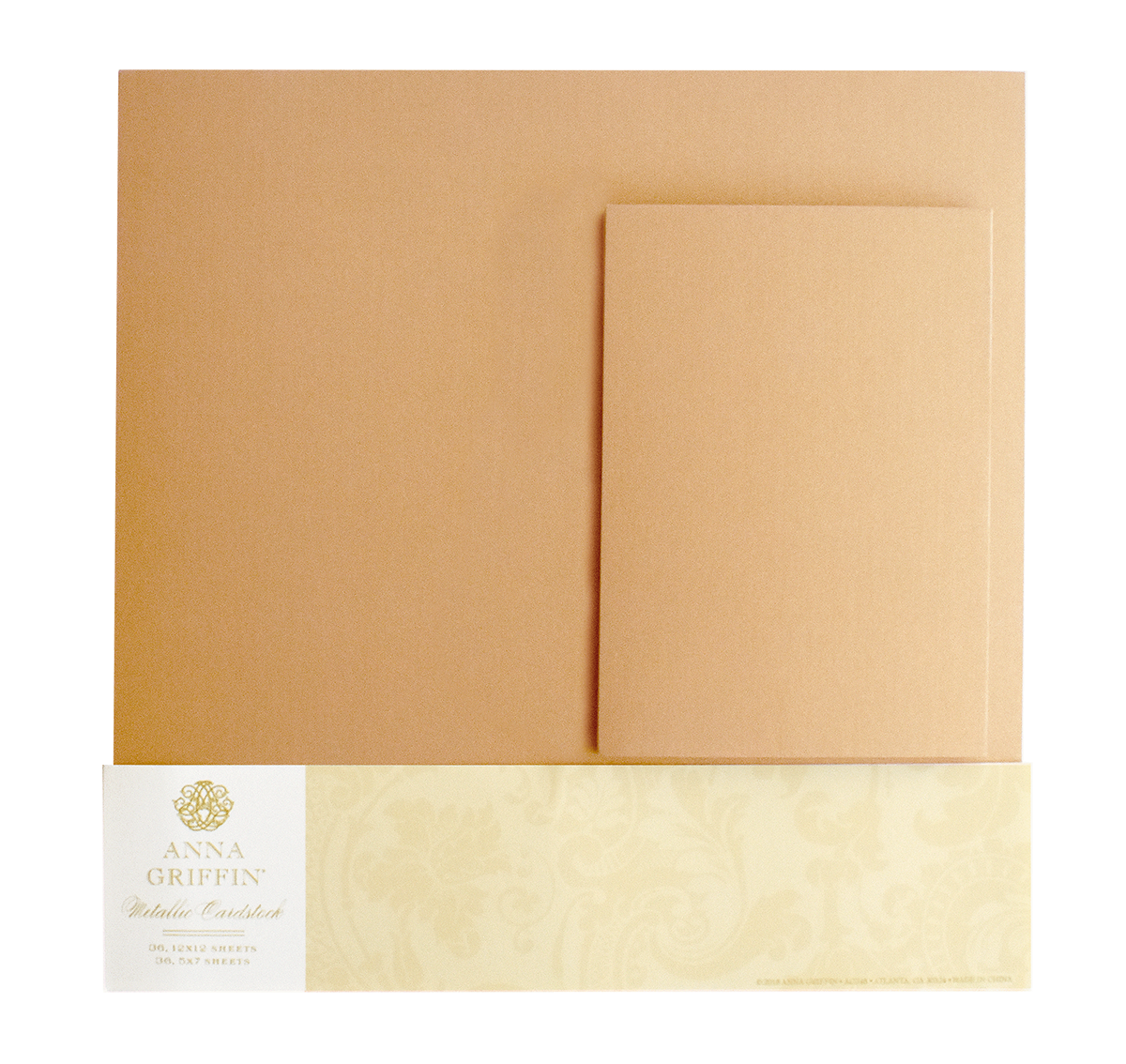 The Metallic Cardstock Bundle, Gold includes 250gsm gold-colored metallic sheets and envelopes, partially packaged with a decorative cream and gold label at the bottom.