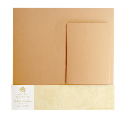 The Metallic Cardstock Bundle, Gold includes 250gsm gold-colored metallic sheets and envelopes, partially packaged with a decorative cream and gold label at the bottom.