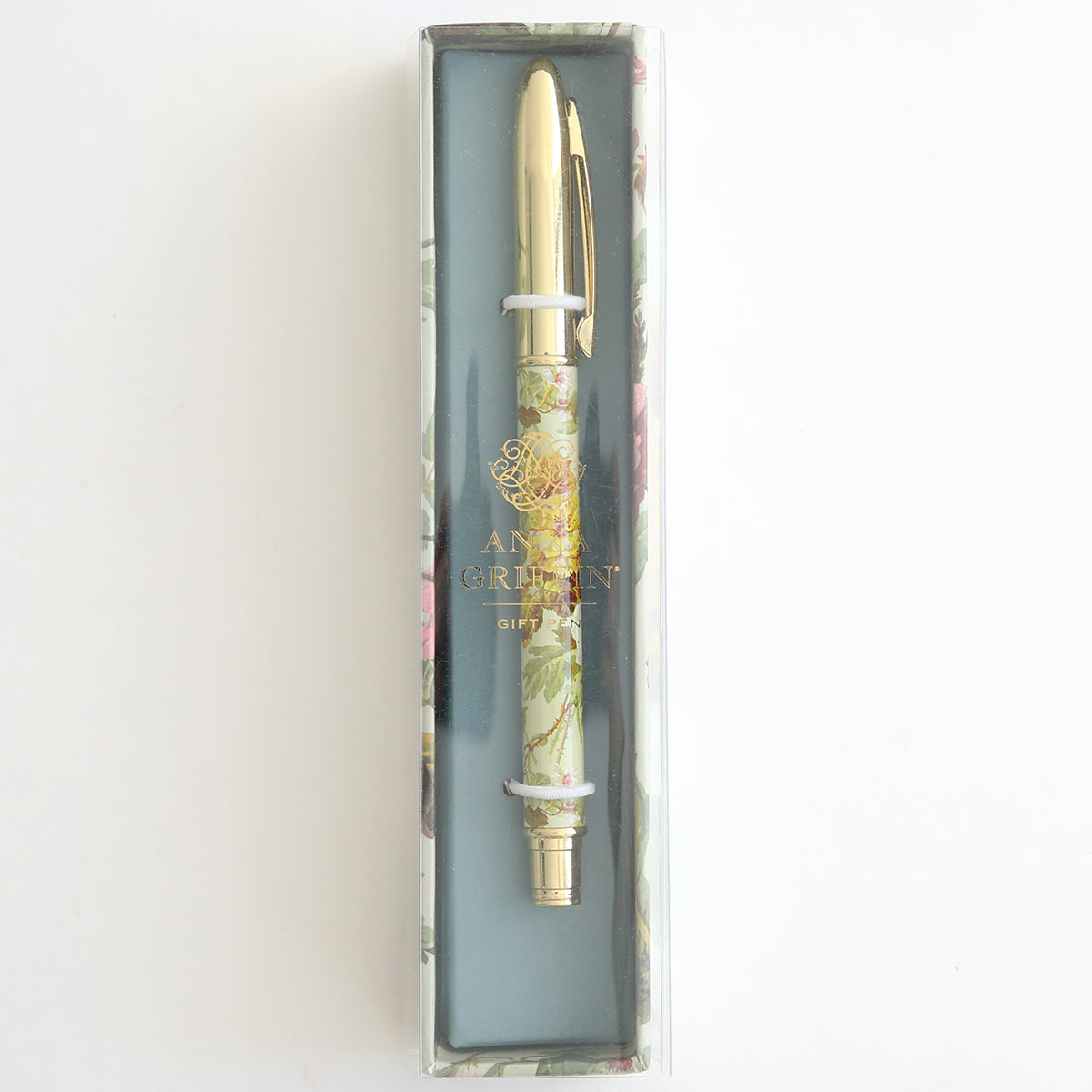 The Francesca Floral Gift Pen, adorned with a floral pattern and gold accents, is elegantly showcased in a clear plastic box marked "Anna Griffin." It's the ideal decorative ballpoint pen for any stationery enthusiast seeking sophistication.