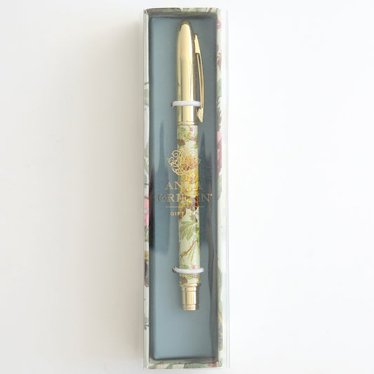 The Francesca Floral Gift Pen, adorned with a floral pattern and gold accents, is elegantly showcased in a clear plastic box marked "Anna Griffin." It's the ideal decorative ballpoint pen for any stationery enthusiast seeking sophistication.