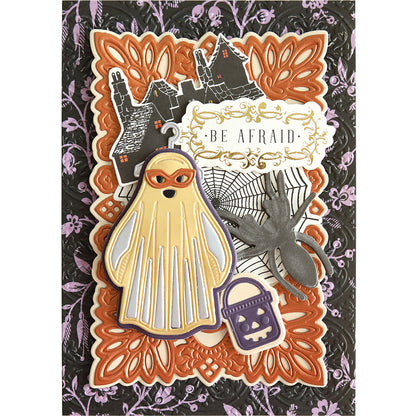 A Halloween Costume Dies card featuring a ghost, spider, haunted houses, and the text "BE AFRAID" on a decorative background. Ideal for Trick or Treat enthusiasts!