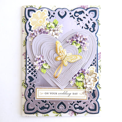 A Japanese-inspired wedding card featuring Heart Kirigami Dies adorned with delicate flowers.