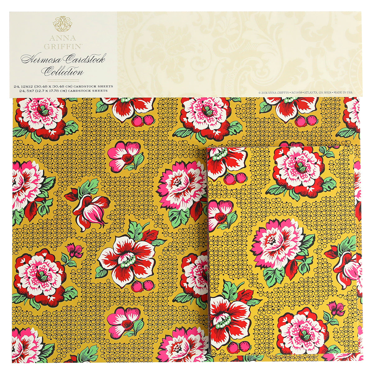 A floral-patterned cardstock pad from Anna Griffin's "Hermosa Multi Cultural Cardstock" featuring red and pink flowers with green leaves on a yellow background, embodying the vibrant essence of Hispanic culture.