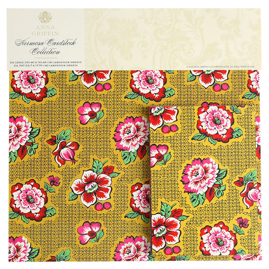 A floral-patterned cardstock pad from Anna Griffin's "Hermosa Multi Cultural Cardstock" featuring red and pink flowers with green leaves on a yellow background, embodying the vibrant essence of Hispanic culture.