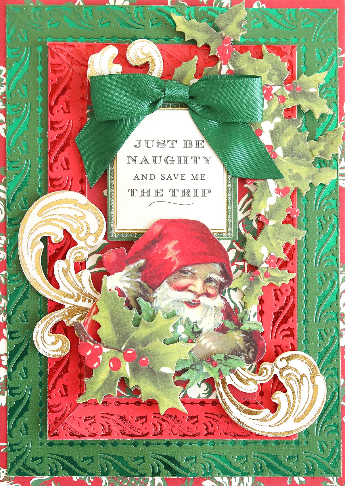 Celebrate the season with our Holiday Coated Cardstock—a festive card printed on heavyweight material, adorned with a vintage Santa, holly accents, elegant gold swirls, and topped with a green bow. The front reads: "Just be naughty and save me the trip." With its vibrant red and green decorative background, this Holiday Coated Cardstock is perfect for all your foil holiday projects.